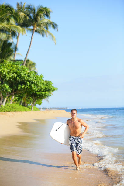 istock Beach lifestyle man surfer with surfing bodyboard 1171756486