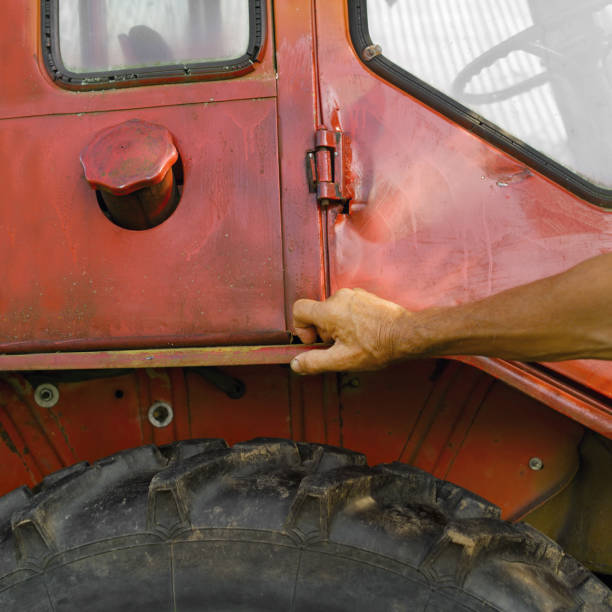 istock driver leaning against the tractor cabin 1171756947