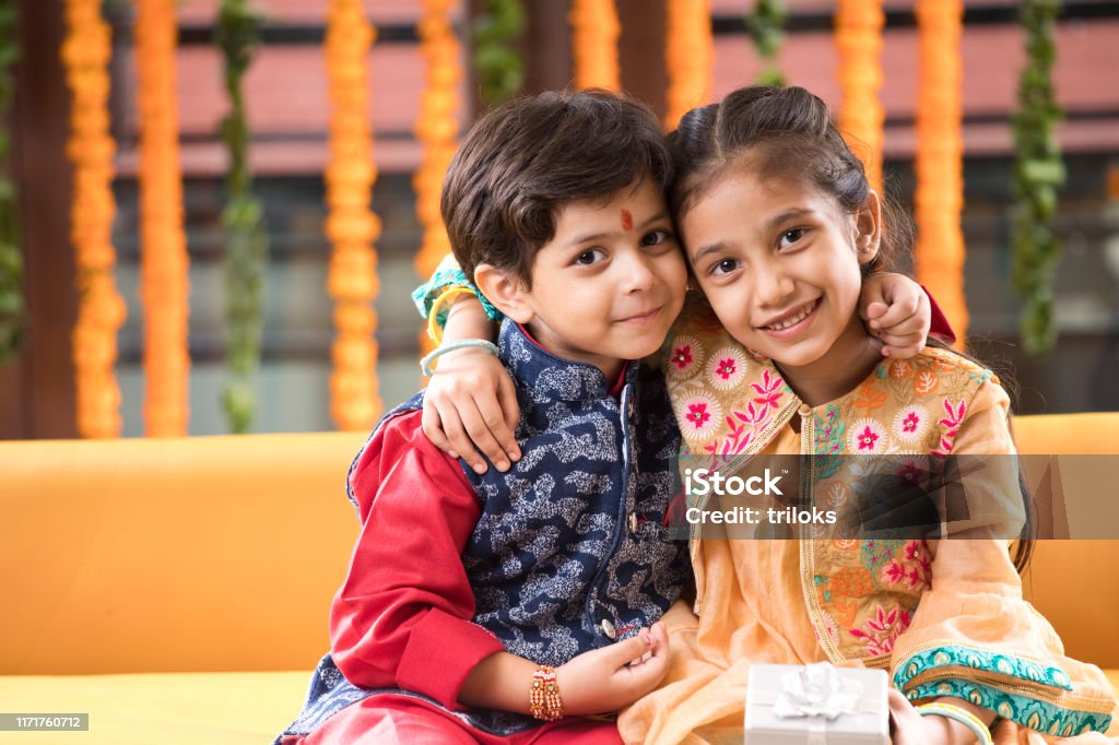 Loving brother and sister Loving Indian brother and sister in traditional clothing Brother Stock Photo