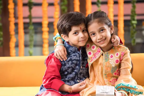 Loving Indian brother and sister in traditional clothing