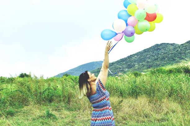 istock Girl with balloons 1171762321