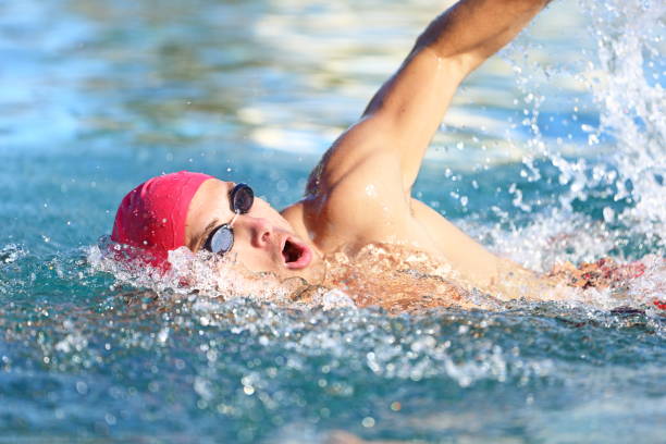 istock Man swimmer swimming crawl in blue water 1171762428