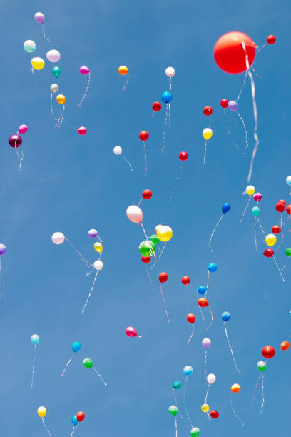 istock Multi-colored helium balloons fly in the sky 1171764117