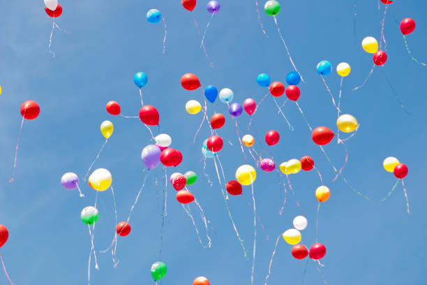 istock Multi-colored helium balloons fly in the sky 1171764119