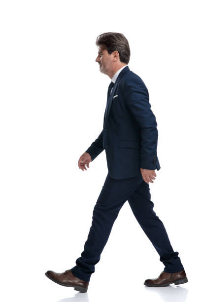 istock Side view of a determined old businessman stepping forward 1171765269