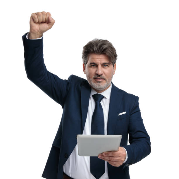 istock Old businessman holding his tablet and celebrating 1171765550