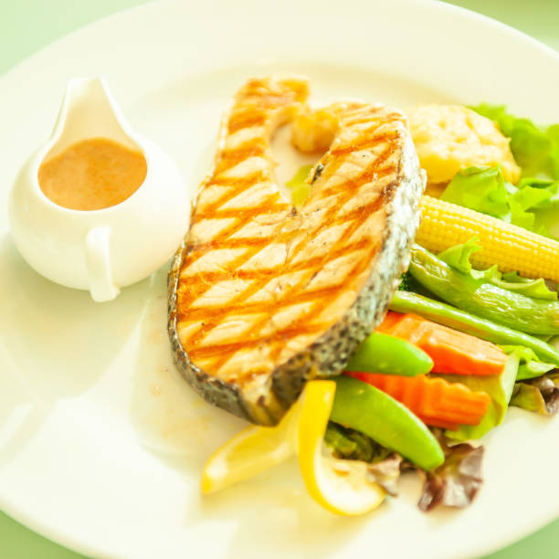 istock Grilled salmon with vegetables on white plate. 1171767078