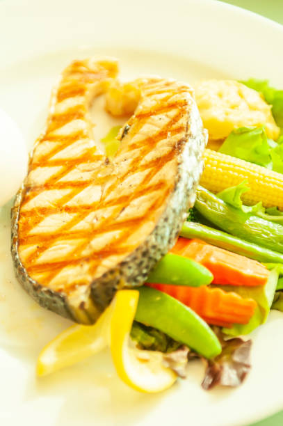 istock Grilled salmon with vegetables on white plate. 1171767115