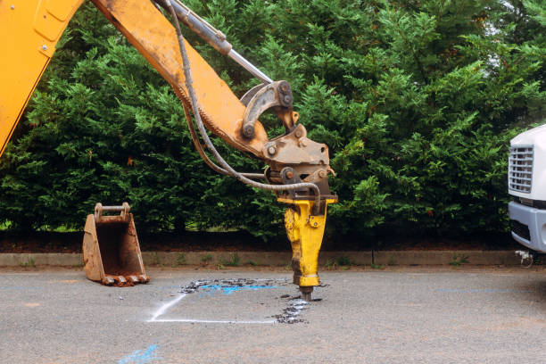 istock Large jackhammer crushing asphalt paving during road construction works 1171768601