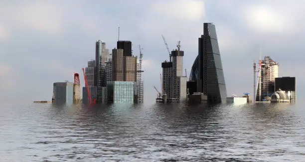 manipulated conceptual image of the city of london area flooded due to global warming and rising sea levels