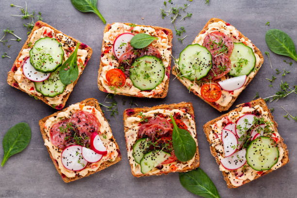 istock Sandwiches with cream cheese, vegetables and salami. 1171770060