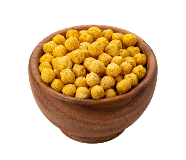 istock Corn balls flakes in wooden bowl isolated on white background 1171772333