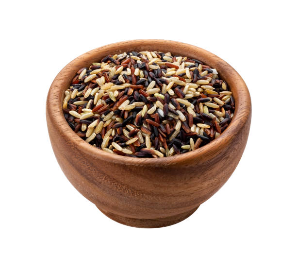 istock Rice mix in wooden bowl isolated on white background 1171772377
