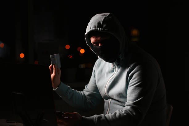 istock Man carder in mask connect to darknet 1171773471