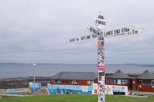 John o'Groats, Caithness, Scotland - May 09 2017: A signpost in the village of John o'Groats. It is part of the North Coast 500 road trip.