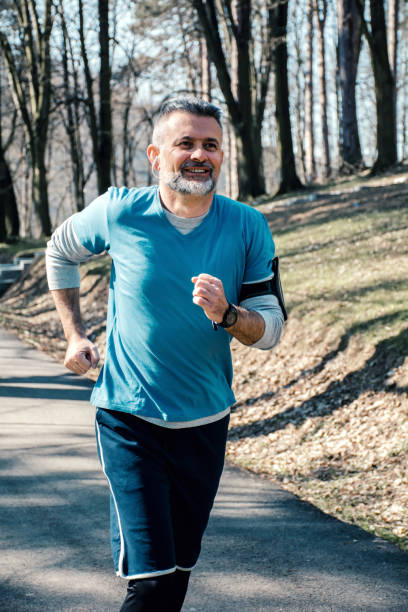 istock Mature man jogging in the morning 1171778478