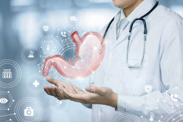 istock The doctor shows the patient stomach on blurred background. 1171778570