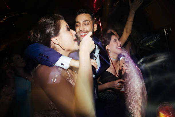 istock Groom dancing with friends and enjoying a wedding party 1171778971