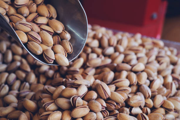 istock Pistachios nuts on pistachios background. Healthy snacks. Close up image. Free space for text. 1171779844
