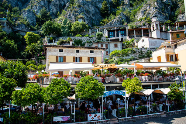 Limone sul Garda, Lombardy, Italy - 15, June 2024: Limone sul Garda with its historic center is a small pearl located on Lake Garda in the province of Brescia, at the foot of imposing mountains that immerse themselves in the lake