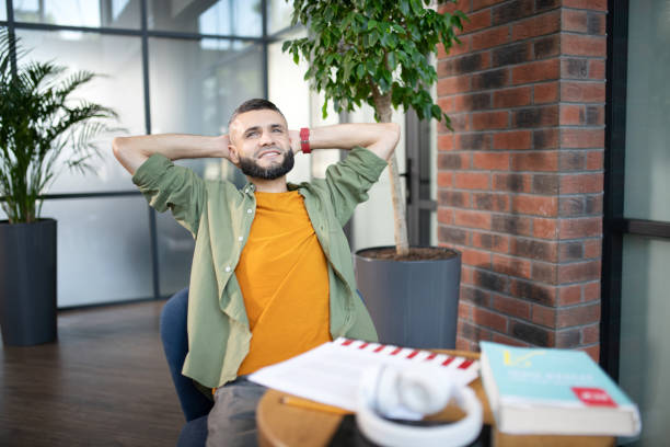 istock Bearded man feeling satisfied after studying at the weekend 1171780941
