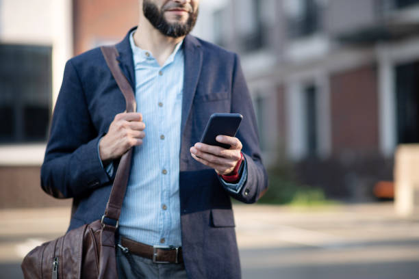 istock Busy bearded businessman reading message on phone 1171781074