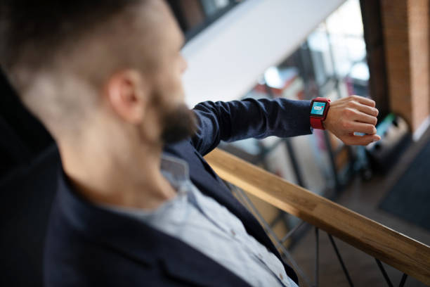 istock Top view of businessman looking at notifications on smart watch 1171781133