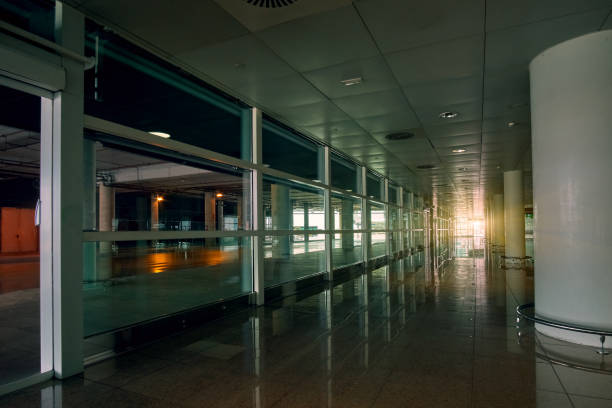 istock Empty modern international airport hall with sunset sunlight on background 1171781368