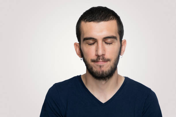 istock Portrait of  sad young man over grey background 1171781624