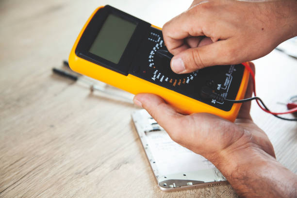 istock man hand tester and phone 1171782606
