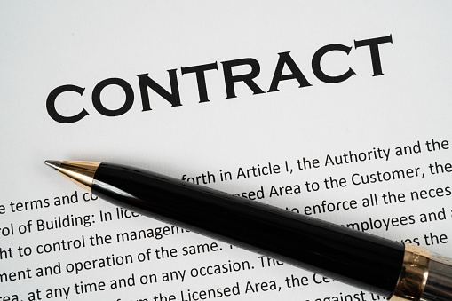 Close up of a Contract with pen ready to be signed