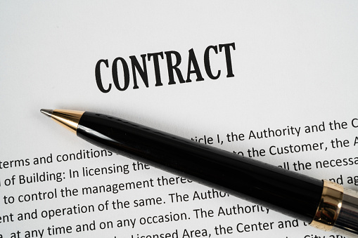 Close up of a Contract with pen ready to be signed