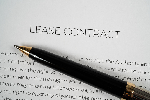 Pen on top of a lease contract ready to be signed