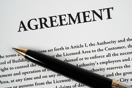 Close up of  an Agreement with pen ready to be signed