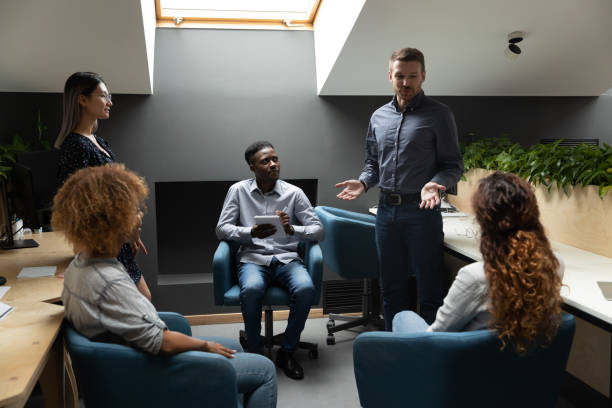 istock Confident male manager explain project strategy at corporate group meeting 1171786236