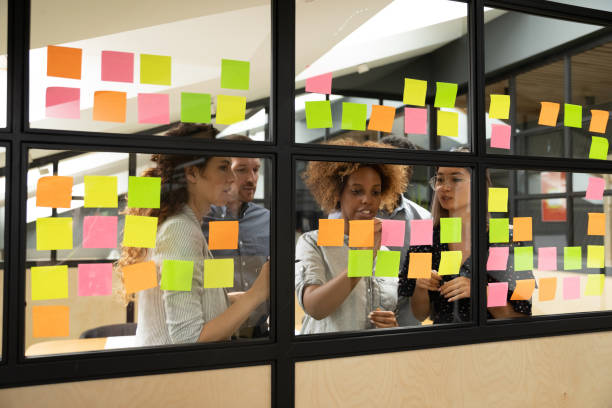 istock Multiracial business team brainstorm on project write on sticky notes 1171786307