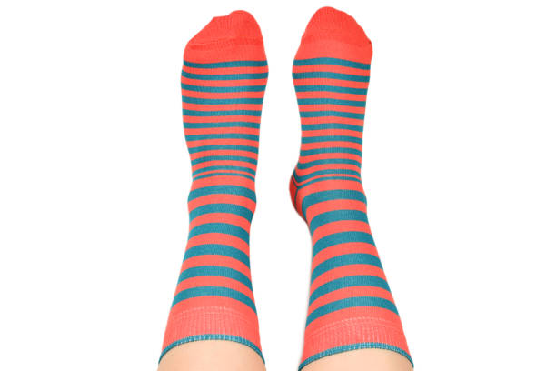 istock Woman in orange socks isolated on white background. Top view. 1171786441