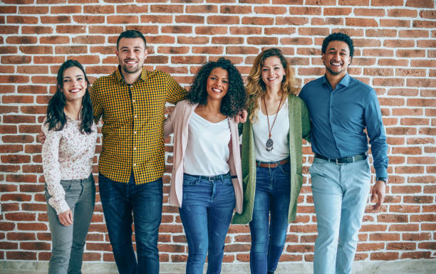 istock Group of colleagues standing in an office 1171787441
