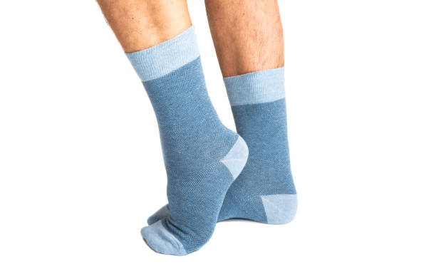 istock socks on the legs of a man isolated 1171788669