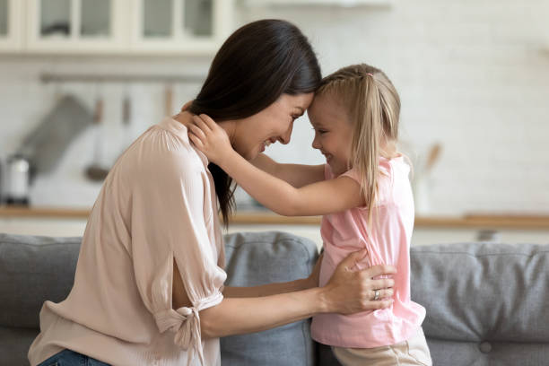 istock Mother daughter looking at each other touch foreheads feeling love 1171789145