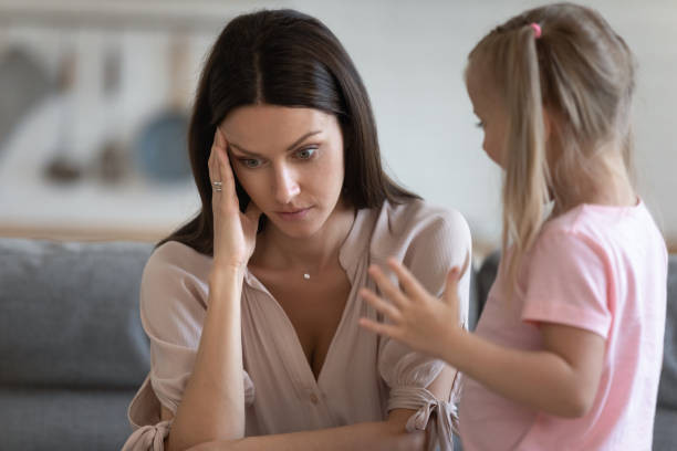 istock Annoyed mom and restless little daughter at home 1171789185
