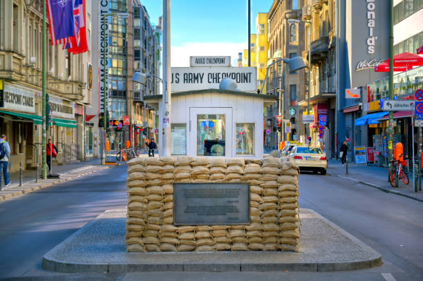 Checkpoint Charlie in Berlin, Germany Berlin, Germany - May 5, 2019 - The Checkpoint Charlie Memorial site located in the Mitte district of Berlin, Germany. soldier on the wall stock pictures, royalty-free photos & images