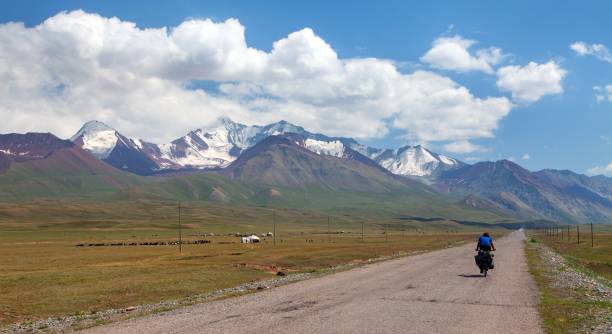 istock Pamir highway or pamirskij tract with biker 1171797054