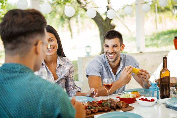 istock Friends on a terrace making a dinner party 1171797796