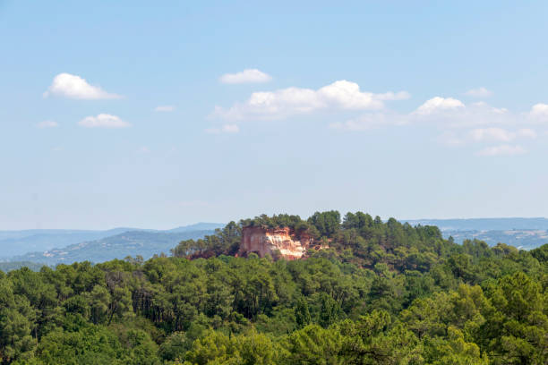 istock Ochre Trail in Roussillon, Hiking path in orange ocher cliffs surrounded by green forest in Provence, Southern France 1171799447