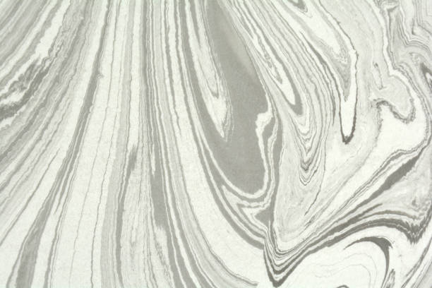istock Mix of a white and black paint, closeup. Abstract marbling texture. Handmade ebru technique. 1171799664