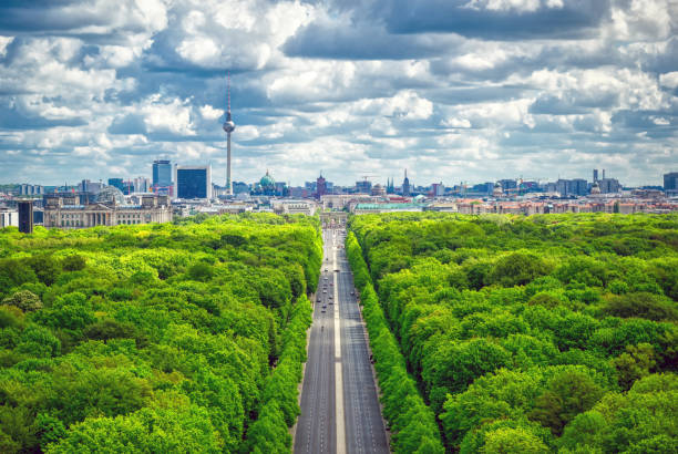 The Tiergarten and Berlin, Germany An aerial view of the Tiergarten and Berlin, Germany from the Victory Column on a sunny day. berlin germany urban road panoramic germany stock pictures, royalty-free photos & images