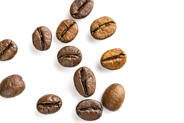 istock Roasted coffee beans isolated in white background cutout. Coffee background or texture concept. 1171805749