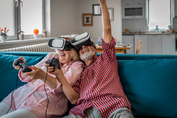 istock Mature couple playing virtual reality games. Virtual Reality Simulator. 1171807049