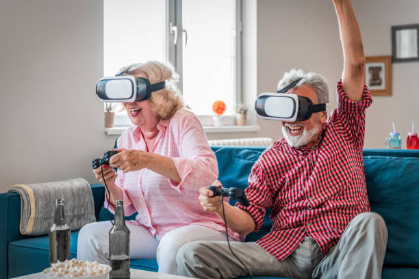 istock Mature couple playing virtual reality games. Virtual Reality Simulator. 1171807740